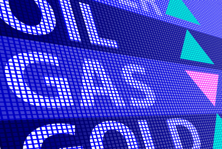Blaues digitales Display mit den Wörtern „Oil“, „Gas“ und „Gold“. Bunte Pfeile zeigen nach oben und unten.